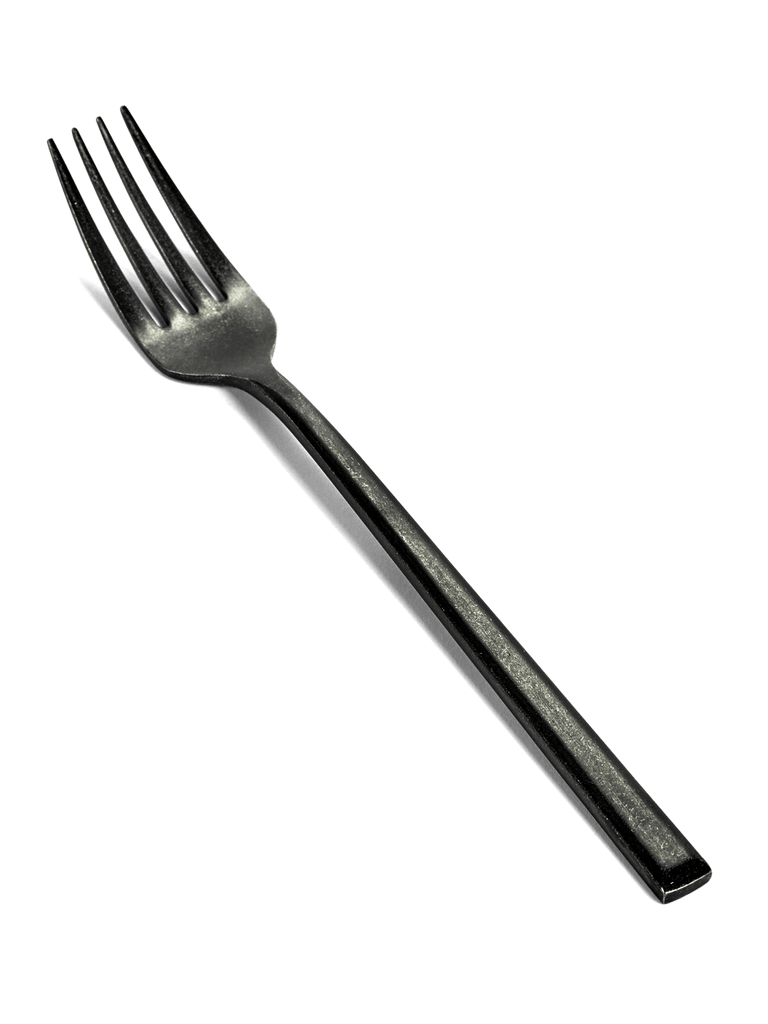 A black flatware fork on a white background by SERAX, with a pure design aesthetic by Pascale Naessens.