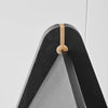 A close up of a GEJST REECH STEPLADDER with a black triangle and a gold handle, inspired by Gestalt Haus design principles.