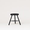 A FORM & REFINE SHOEMAKER CHAIR™ No. 49 featured on a white background with Gestalt Haus influence.