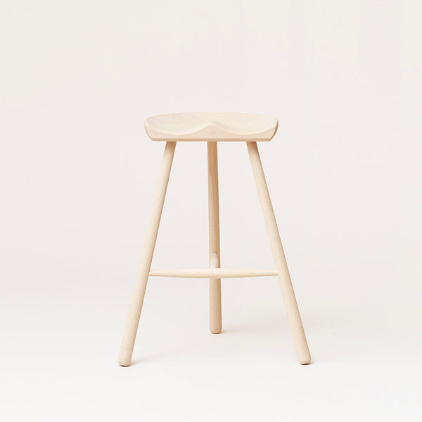 A Gestalt Haus-inspired SHOEMAKER CHAIR™ No. 68 by FORM & REFINE with a wooden seat contrasted against a white background.