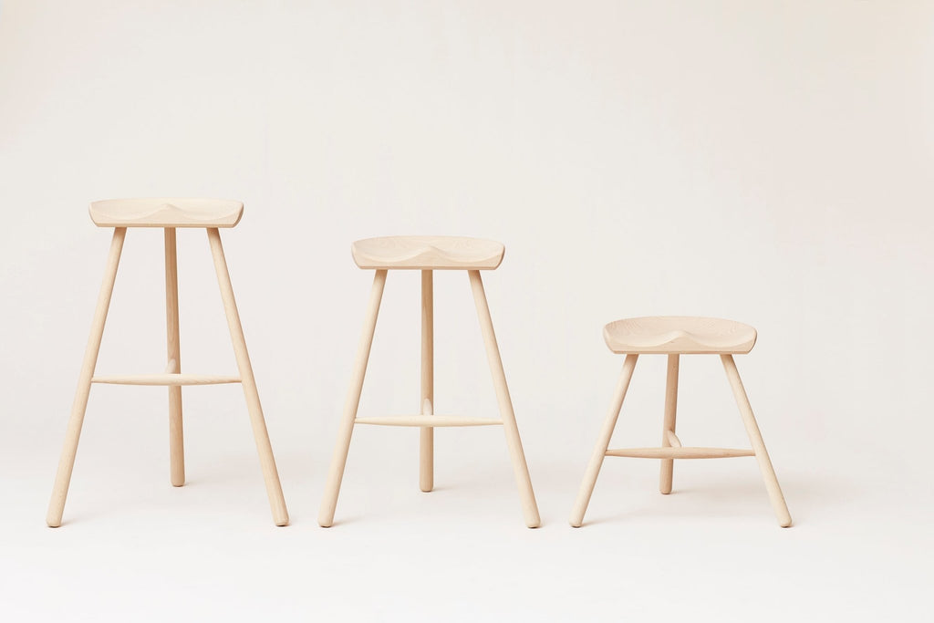 Three wooden stools by FORM & REFINE featuring the SHOEMAKER CHAIR™ No. 78 design, displayed on a minimalistic white background.