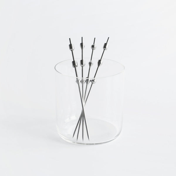 A glass vase with a bunch of FS OBJECTS SPAR COCKTAIL PICKS in it.