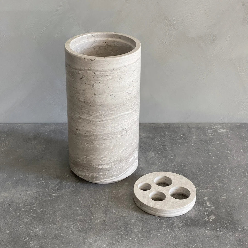 A STEM VASE from BRANDT COLLECTIVE with a cup next to it.