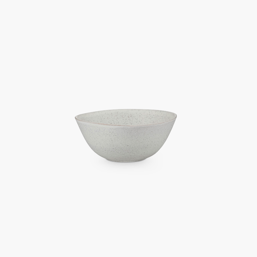 A white bowl on a black background from KLASSIK STUDIO, inspired by Gestalt principles.