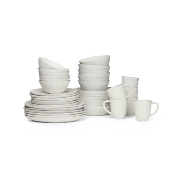 A set of white STUDIO TABLEWARE plates and cups from the KLASSIK STUDIO brand on a white background.