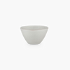 A white STUDIO TABLEWARE bowl on a black background from KLASSIK STUDIO, featuring the minimalistic aesthetic of Gestalt.