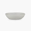 A white STUDIO TABLEWARE bowl on a black KLASSIK STUDIO background with a touch of Gestalt.