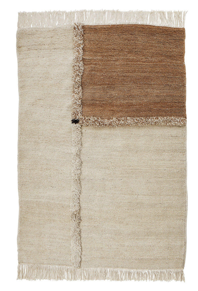 A beige and brown E-1027 rug by Sera Helsinki with fringes in the style of Gestalt Haus.
