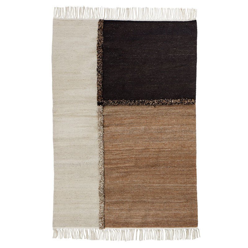 A black and white E-1027 rug with fringes by Sera Helsinki.