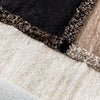 A close up of the SERA HELSINKI E-1027 Gestalt Haus rug, a black, brown and white rug.