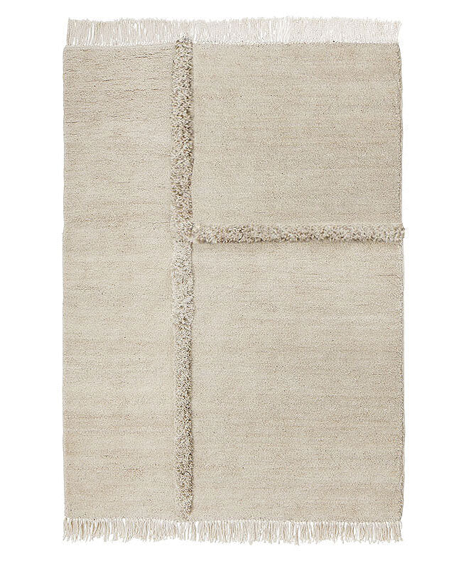 A beige E-1027 rug with fringes on a white background by Sera Helsinki, inspired by Gestalt design principles.