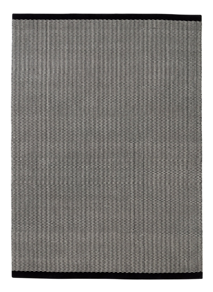 A grey and black Gestalt Haus rug by FABULA LIVING on a white background.