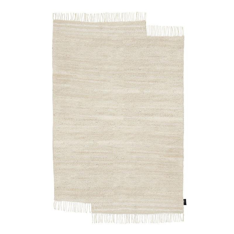 A Hanki II rug by Sera Helsinki with fringes on a white background.