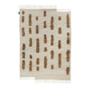 The Sera Helsinki THE LAINE RUG with brown and beige Gestalt Haus stripes on a white background.