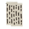 A THE LAINE RUG from SERA HELSINKI featuring black and white stripes in a Gestalt Haus design.