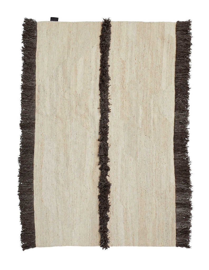 A Sera Helsinki rug with fringes on a white background from Gestalt Haus.
