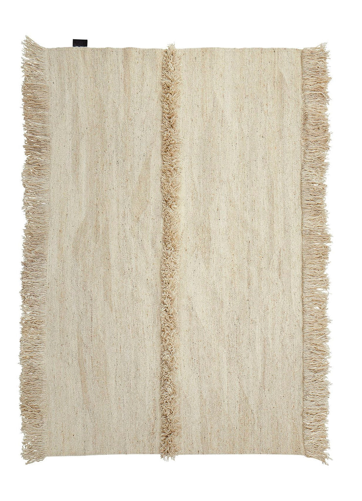 A SERA HELSINKI rug with fringes on a white background, designed with a Gestalt Haus aesthetic.