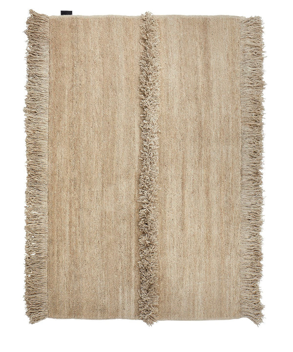 A Nurja rug with fringes on a white background by Sera Helsinki, incorporating Gestalt design principles.