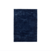 A dark blue Vidar rug by Fabula Living on a white background resembling Gestalt Haus.