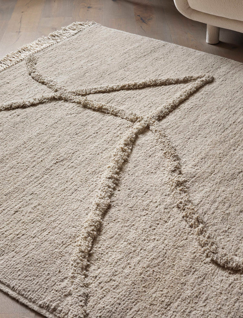 A Vuoristo rug with the letter a on it from Sera Helsinki, inspired by Gestalt Haus.