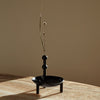 A black STOFF NAGEL vase on a table at Gestalt Haus.