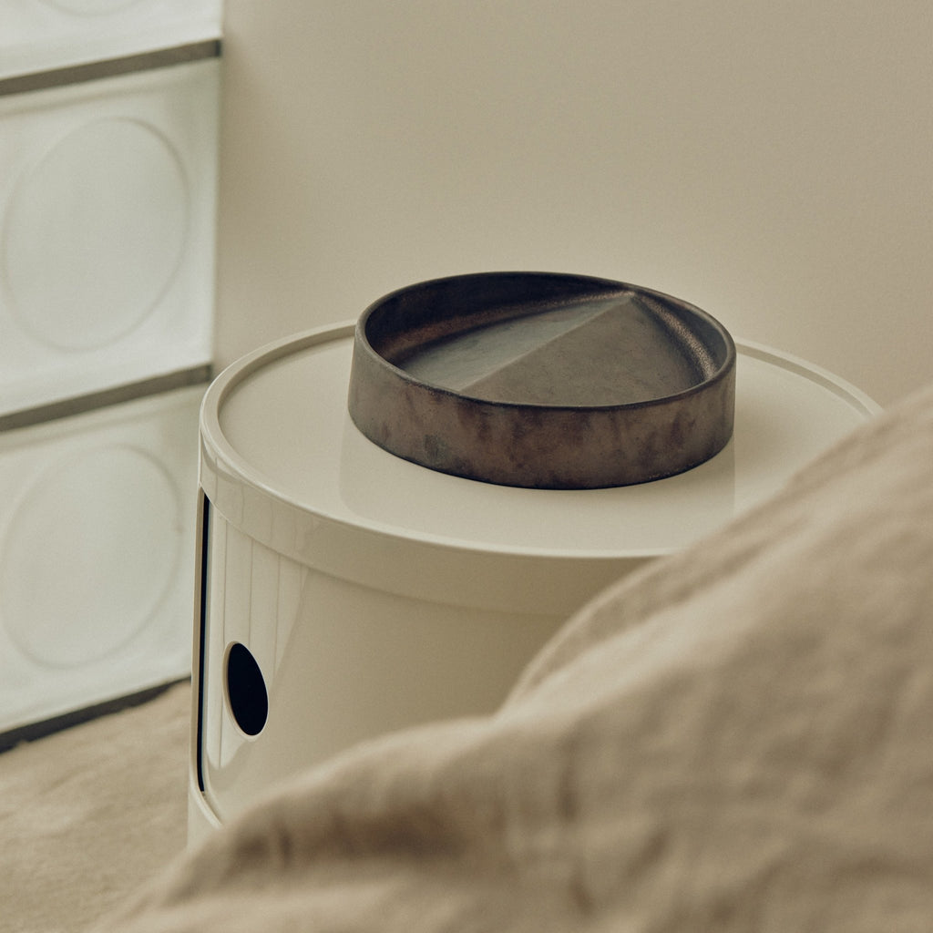 A VIDE POCHE ROND from STUDIO HENRY WILSON is on a bedside table at Gestalt Haus.
