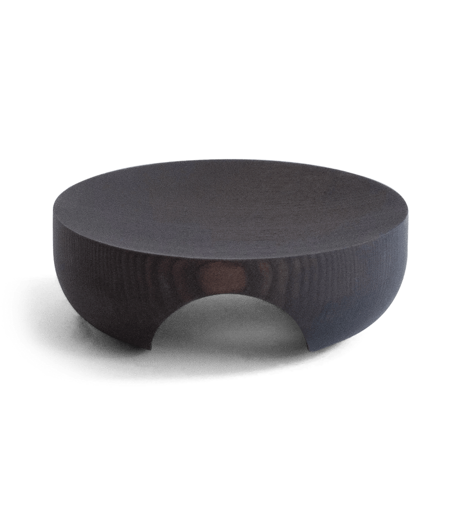 An ORIGIN MADE black wooden coffee table on a white background with a Gestalt Haus aesthetic.
